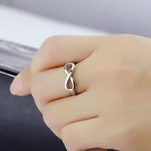 Brand NEW infinity silver ring - size 7